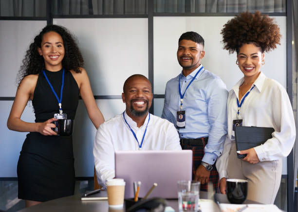 Portrait of a group of confident businesspeople in an office. Happy smiling colleagues motivated and dedicated to success. Cheerful and ambitious team working together in a corporate startup agency